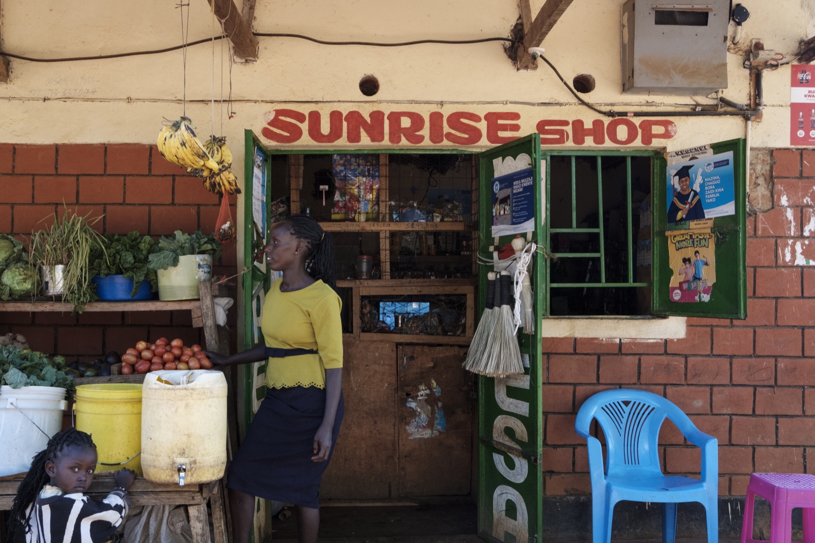 Lois Jemutay in front of her shop